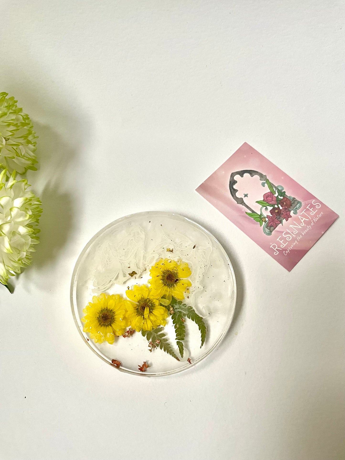 Dried yellow flower and resin coasters