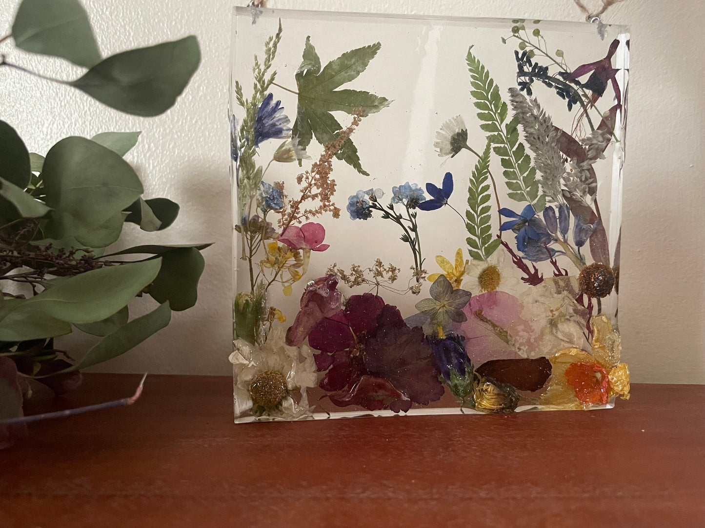 Dried flowers in resin wall art