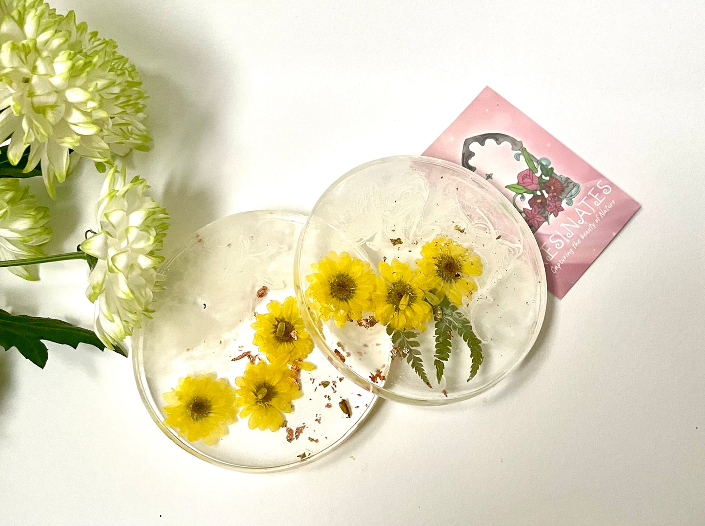 Dried yellow flower and resin coasters