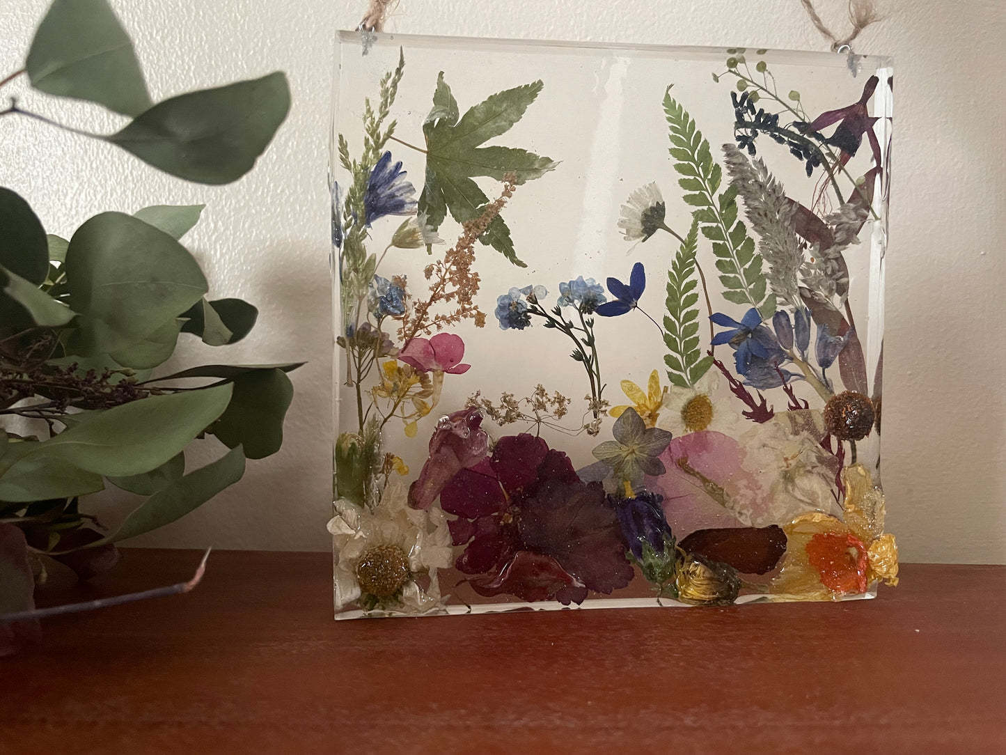 Dried flowers in resin wall art