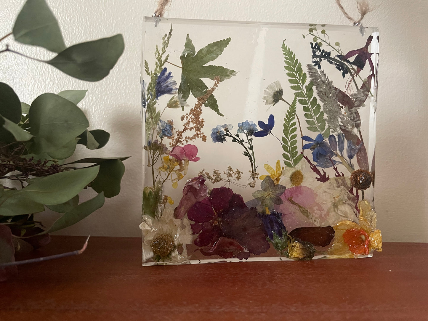 Dried flowers in resin wall art