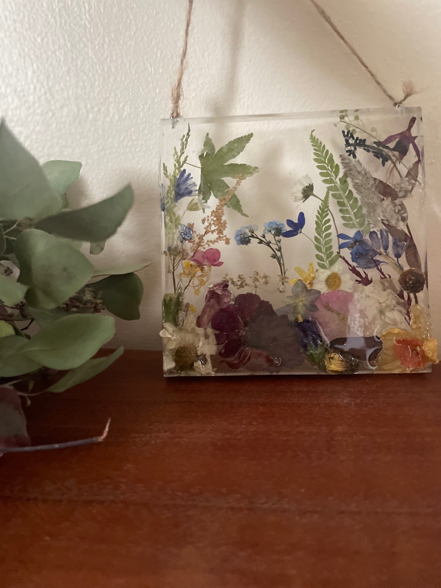 Dried flowers in resin wall art